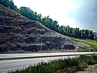 From the base up of this Kentucky Pound Gap Road Cut on Route 23 this exposure begins with the Devonian Ohio Shale, and the Bedford and Beria Sequences, the Mississippian the Sunbury Shale and Grainger Formation at the front of the Pine Mountain Thrust in the Appalachian Basin
