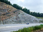 From the base up of the Kentucky side of the Pound Gap Road Cut on Route 23, this exposure begins with the Devonian Ohio Shale, and the Bedford and Beria Sequences, and ends with the Mississippian the Sunbury Shale and Grainger Formation at the front of the Pine Mountain Thrust in the Appalachian Basin