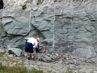 This is a more distant view of the Figure 170 and the interbedded chert rich intraclastic packstone and mudstone fabrics, the chert probably being associated with overlying exposure and soil horizon development of the Lower Mississippian Newman Limestone Formation. Note the 101-paint mark of unit 101 of the measured Geological Section, Kentucky Geological Survey Field Trip Guide, 1998