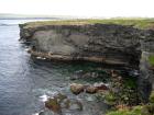 Mud Diapir in deltaic sediments of the Namurian Tullig Formation in foreground, just south of Kilkee Bay.