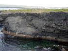Mud Diapir in deltaic sediments of the Namurian Tullig Formation in foreground just south of Kilkee Bay. Cliffs marking the north side of Kilkee Bay in background.