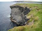 Mud Diapir in deltaic sediments of the Namurian Tullig Formation in foreground just south of Kilkee Bay. Cliffs marking the Georges Head
in background.